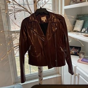 Maroon faux leather biker jacket.
